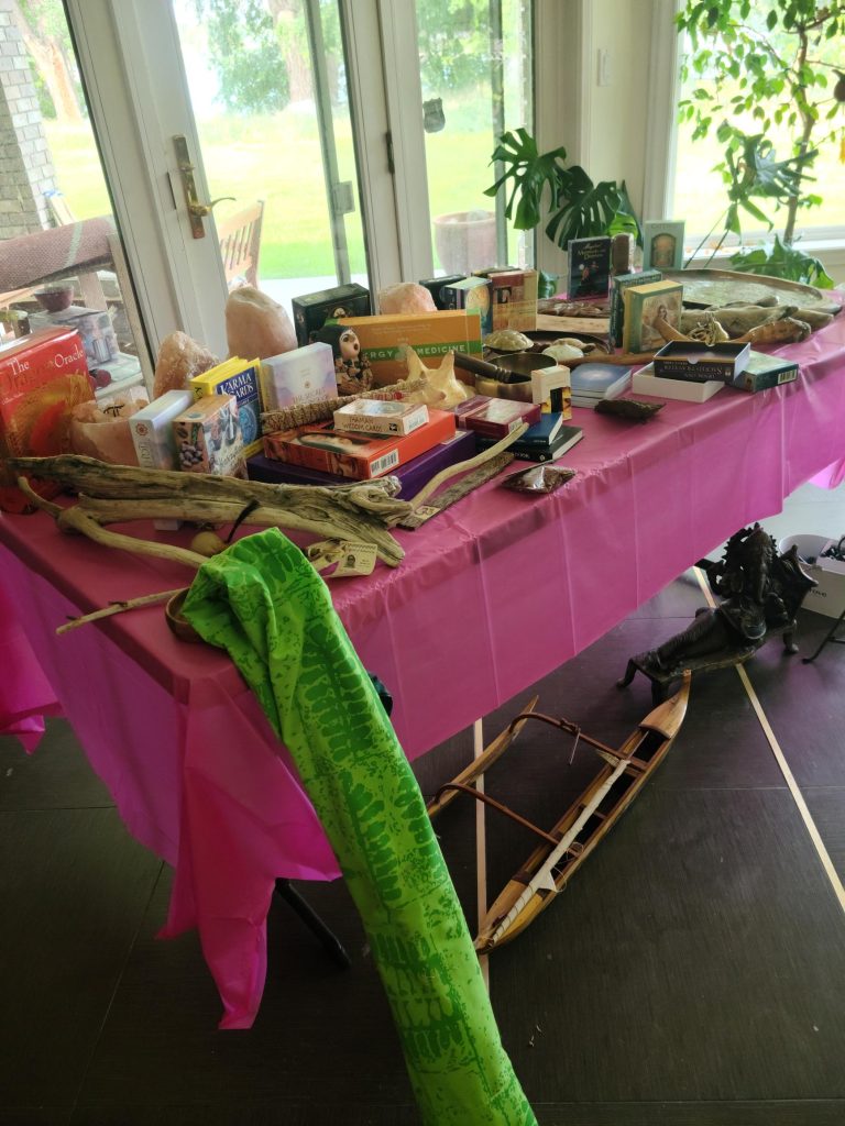 Sunroom set up with tables of items for an estate sale